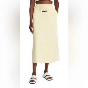 Fear of God Essentials cotton jersey yellow midi skirt